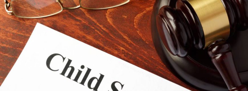 Child support agreement on an office table. Child support agreement on an office table.